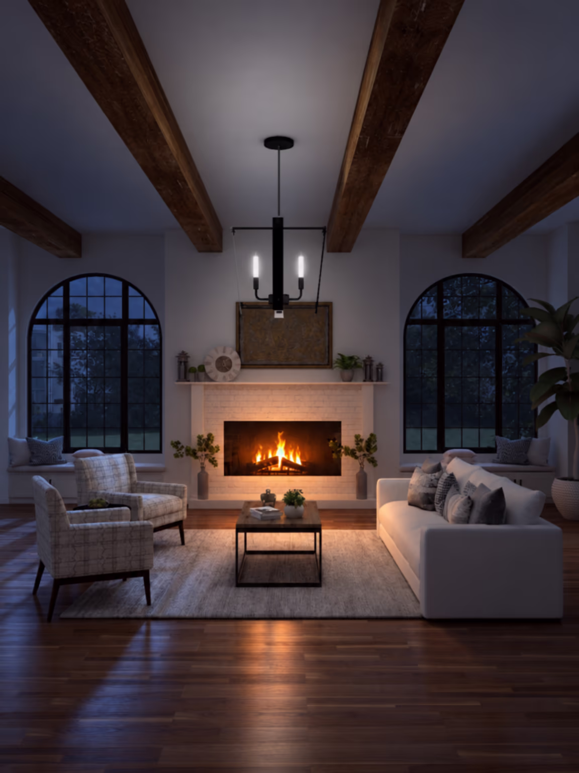 The same living room after Room Lights: night outside the windows, a fire burning in the fireplace, the chandelier's candle bulbs lit, and warm light spilling across the floor and furniture.